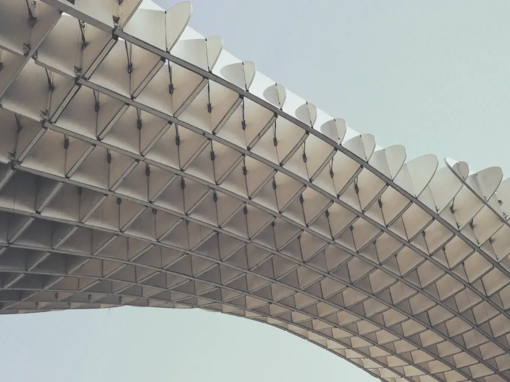 Sweeping modern timber-lattice architecture seen from below