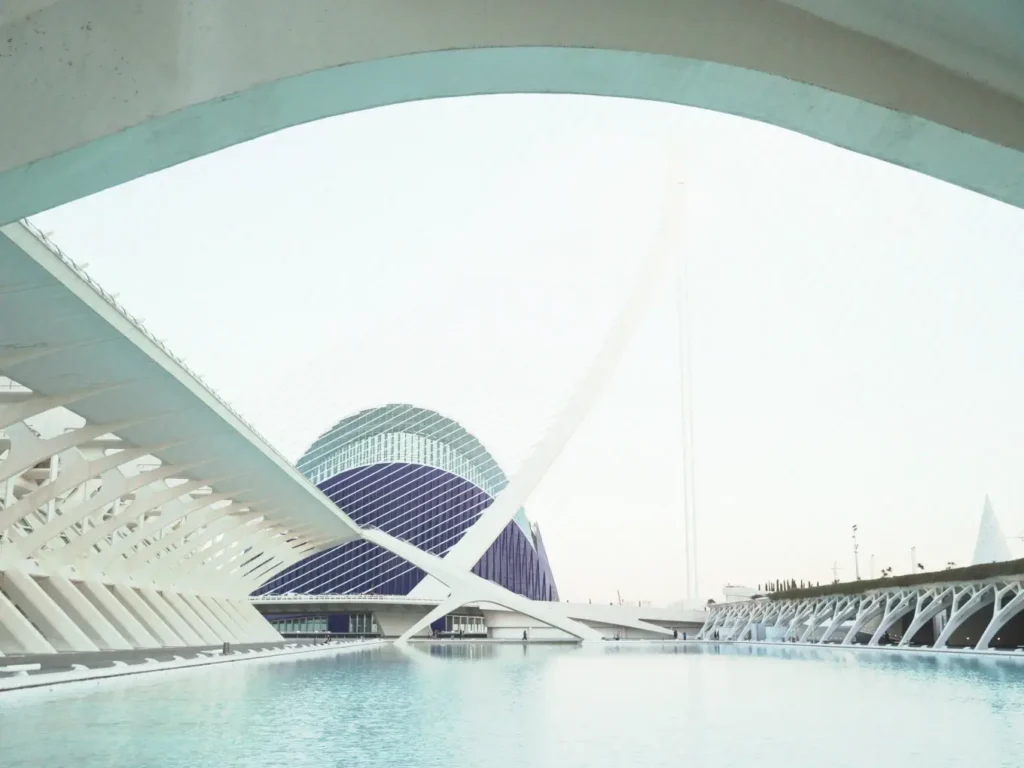 Modern white arched architecture spanning water