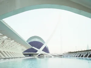 Modern white arched architecture spanning water