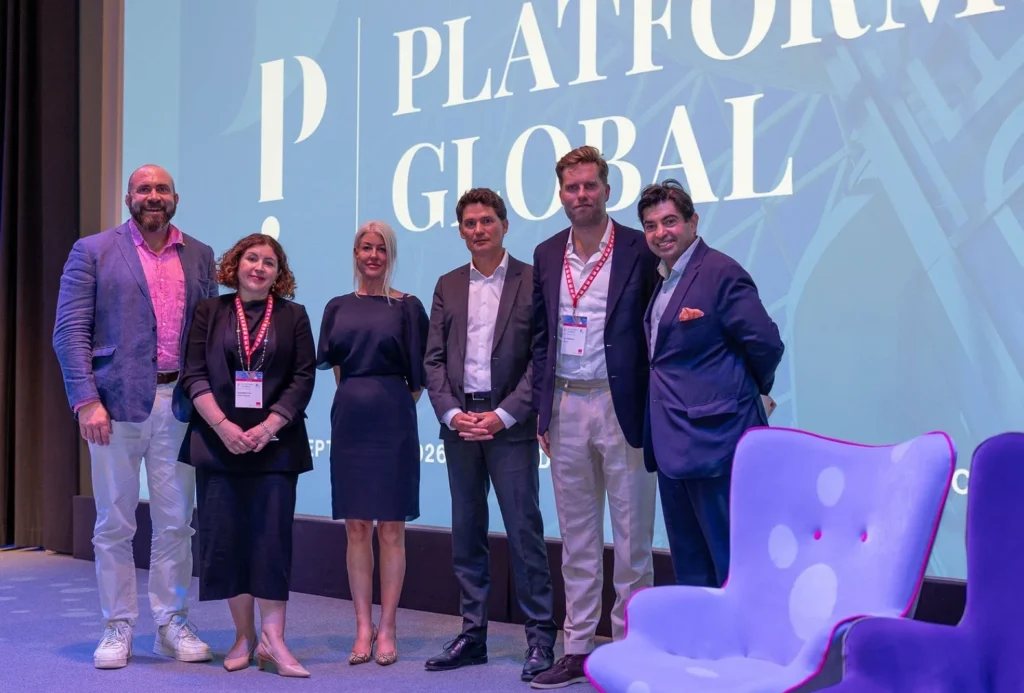 Kelly Palmer with fellow panellists in front of the Platform Global screen in Antibes